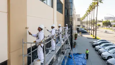Los Angeles, CA painting company crew preparing a home exterior repaint project